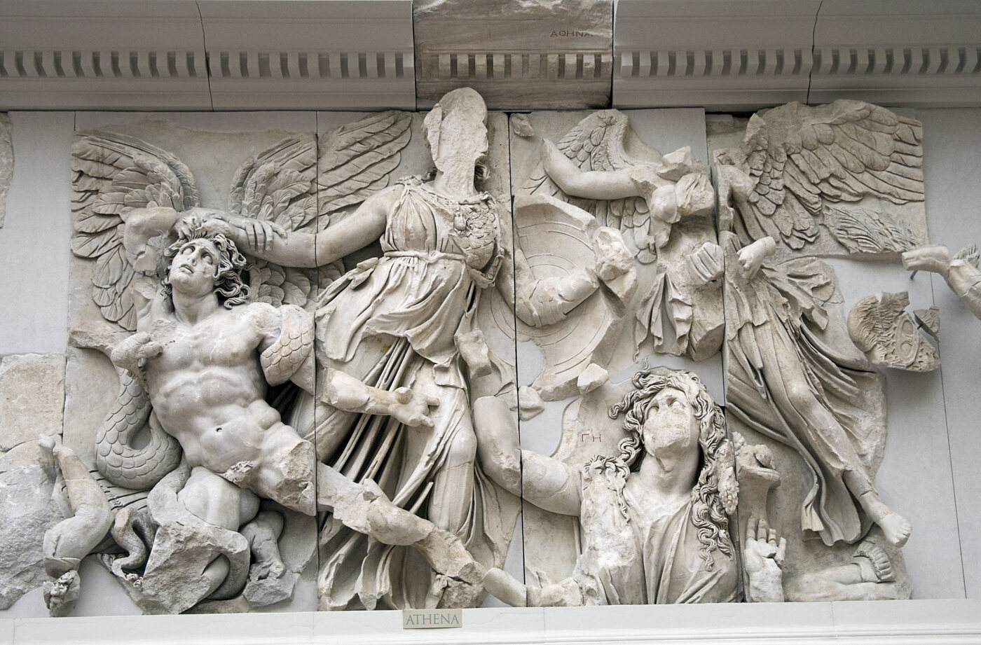 Marble relief from the Pergamon Altar showing Athena and Nike battling the Giant Alkyoneus.
